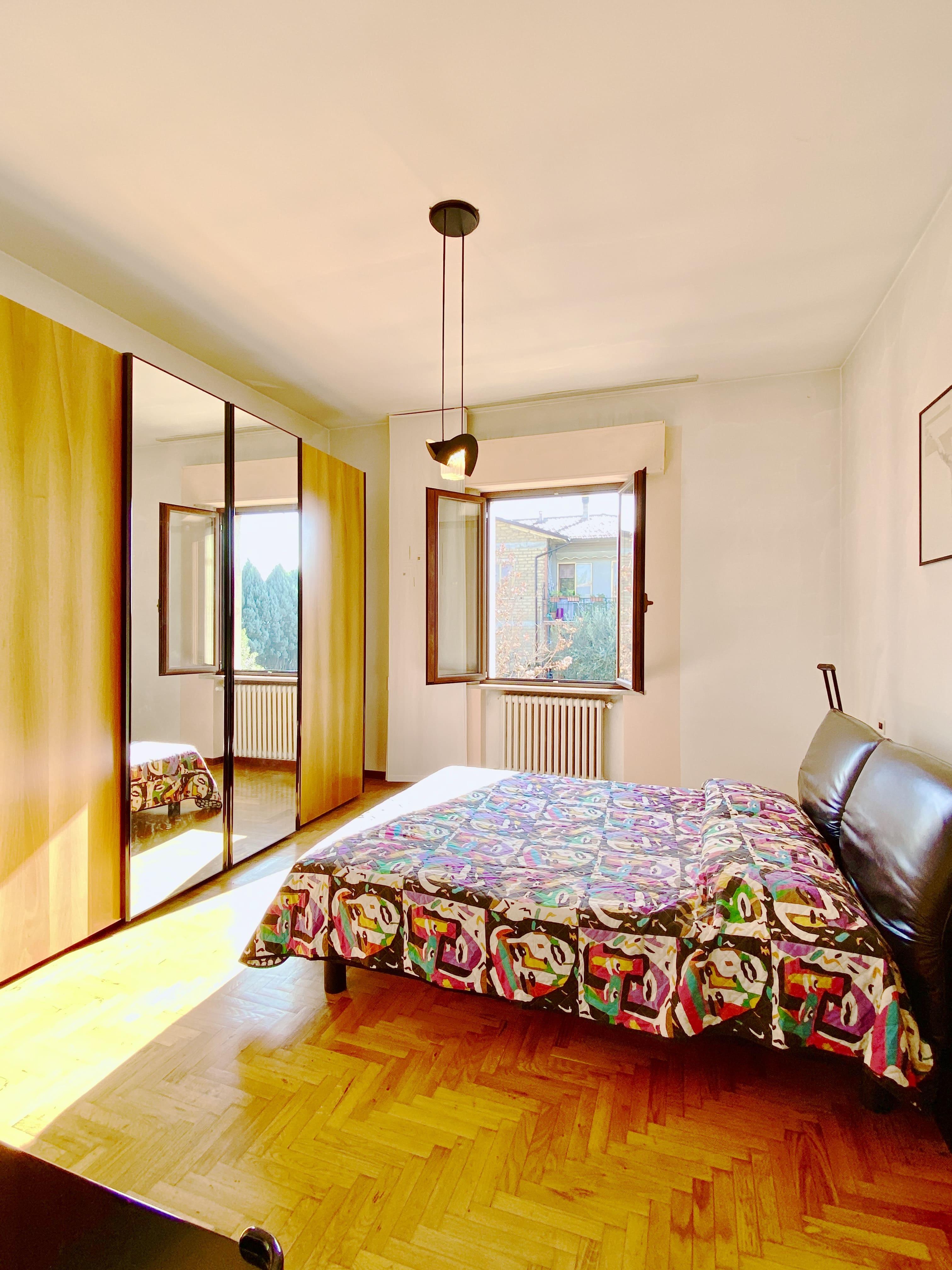 Spacious double bedroom with parquet floor